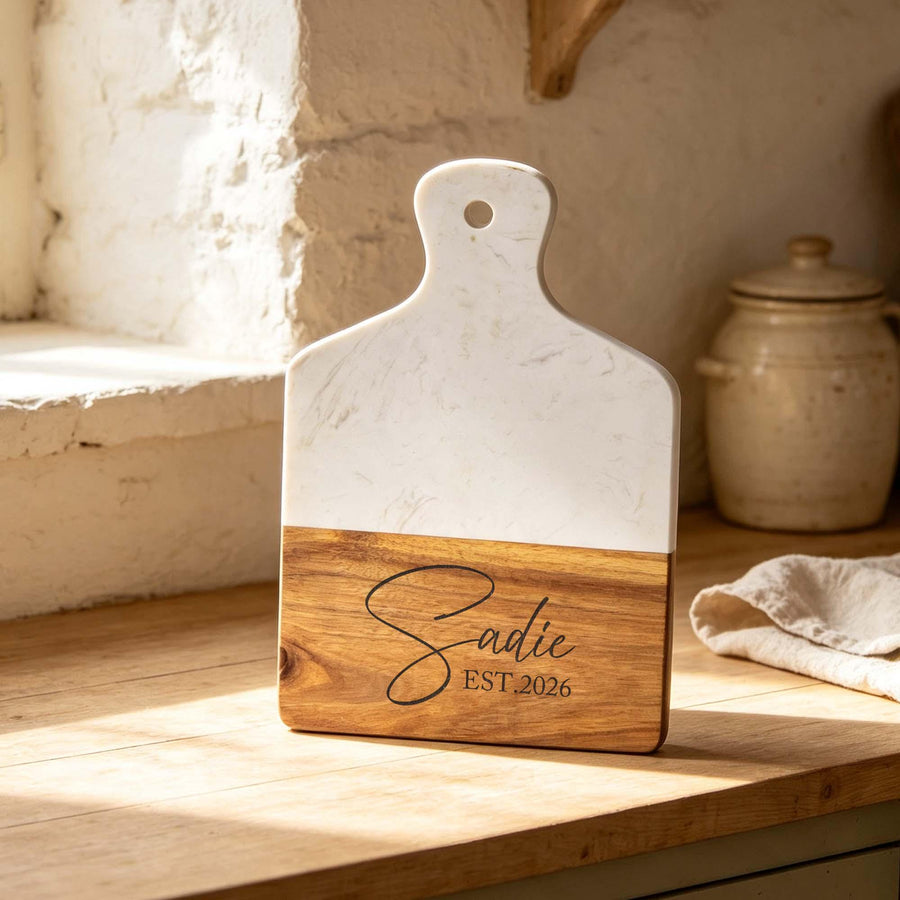 Personalised Marble & Acacia Serving Board with Handle: marble and acacia paddle board engraved with a name and year