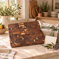 Engraved End-Grain Acacia Chopping Board: engraved end-grain acacia chopping board with a gift box on a kitchen worktop