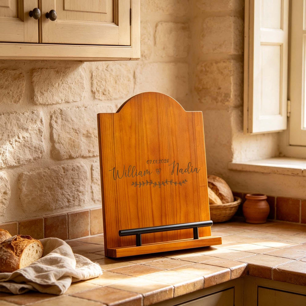 Personalised Acacia Cookbook Stand: arched acacia cookbook stand beside bread on a worktop