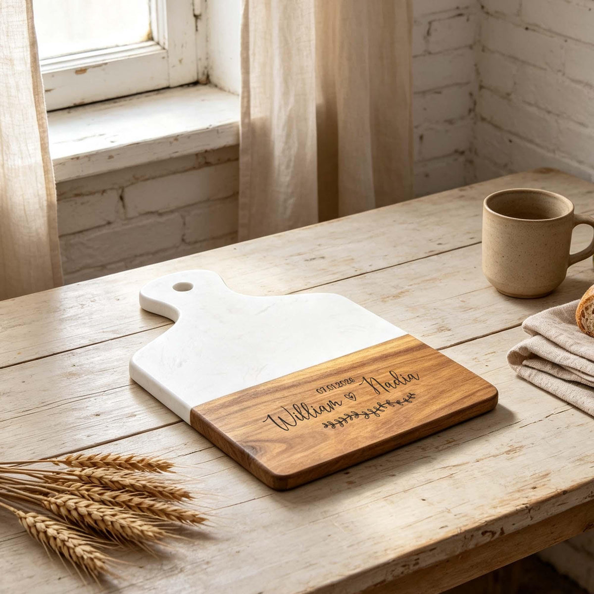 Personalised Marble & Acacia Serving Board with Handle: marble and acacia board on a table by a window