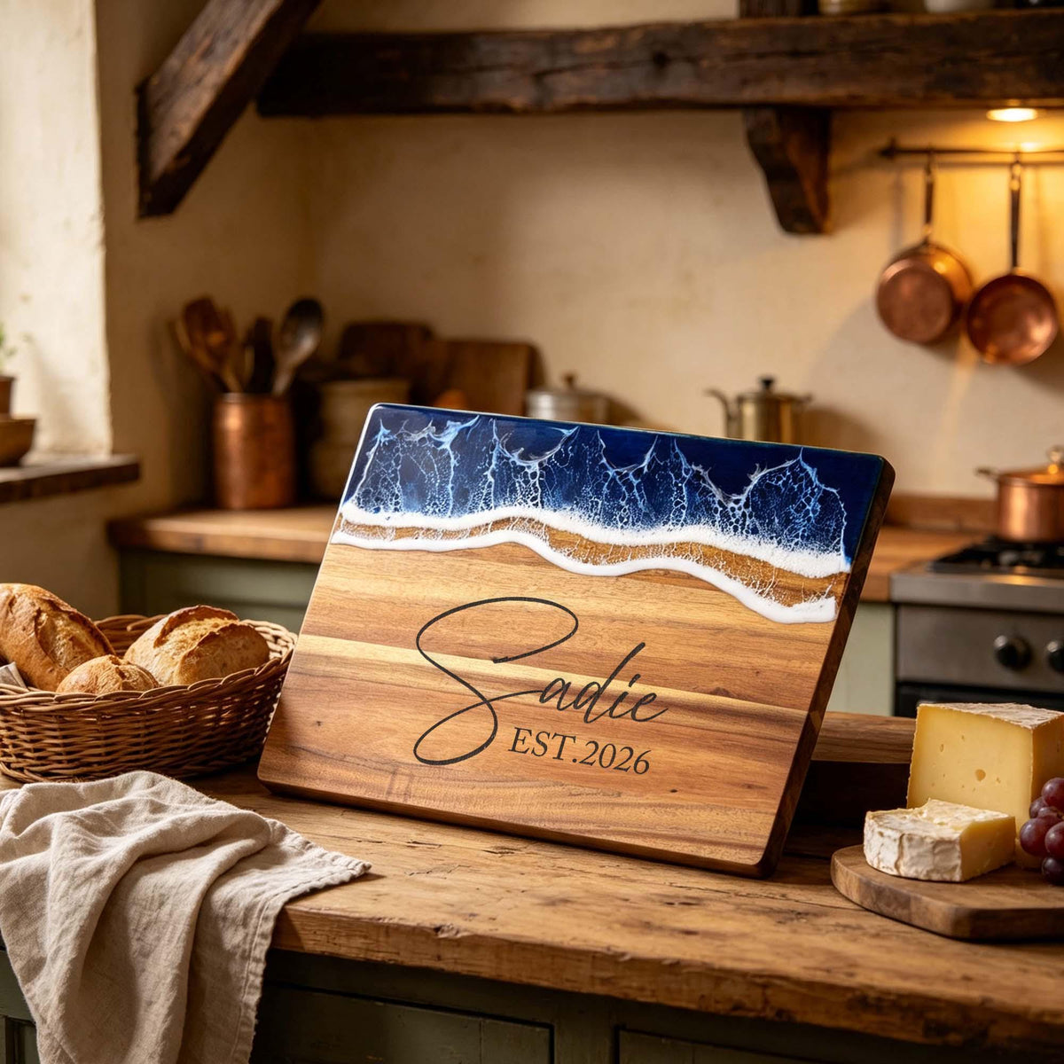 Personalised Ocean Resin & Acacia Charcuterie Board: acacia charcuterie board with a blue ocean resin edge, engraved with a name and year