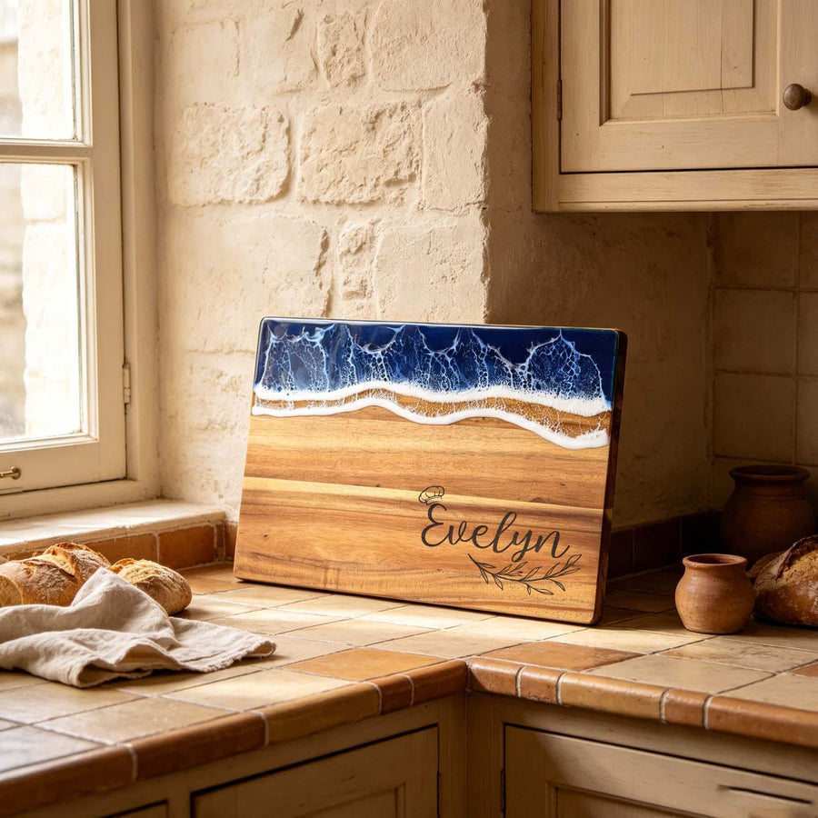 Personalised Ocean Resin & Acacia Charcuterie Board: ocean resin and acacia board standing on a kitchen windowsill