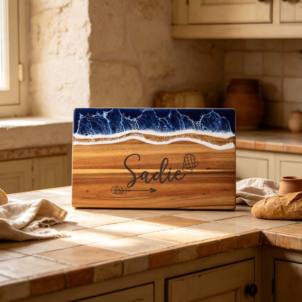 Personalised Ocean Resin & Acacia Charcuterie Board: ocean resin board engraved with a name, beside bread and cheese
