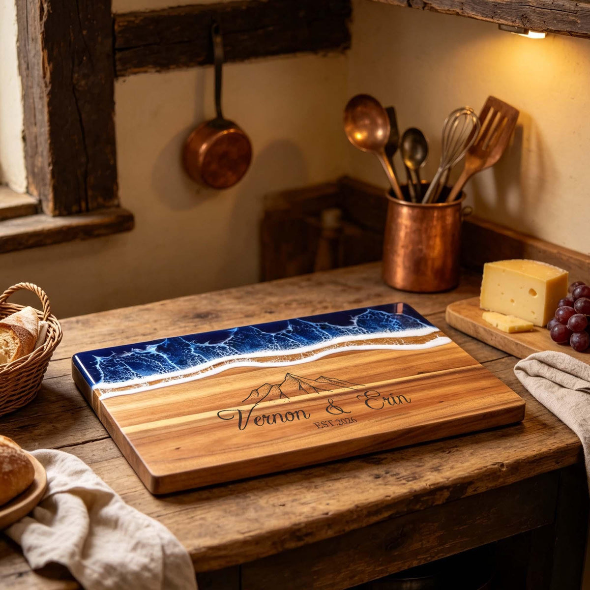 Personalised Ocean Resin & Acacia Charcuterie Board: ocean resin and acacia board engraved with two names and a mountain design