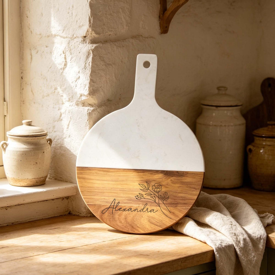 Personalised Round Marble & Acacia Serving Board: round marble and acacia serving board engraved with a name, standing in a sunlit kitchen